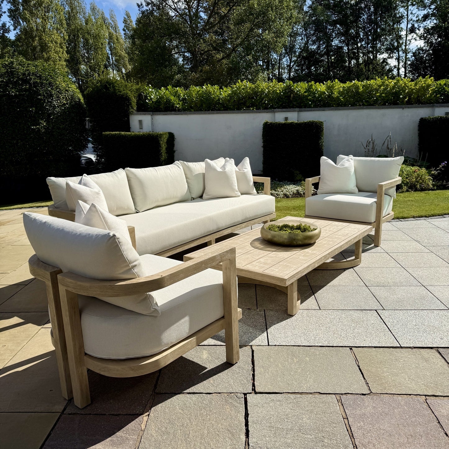 Hamilton Teak outdoor furniture set arranged in elegant patio display