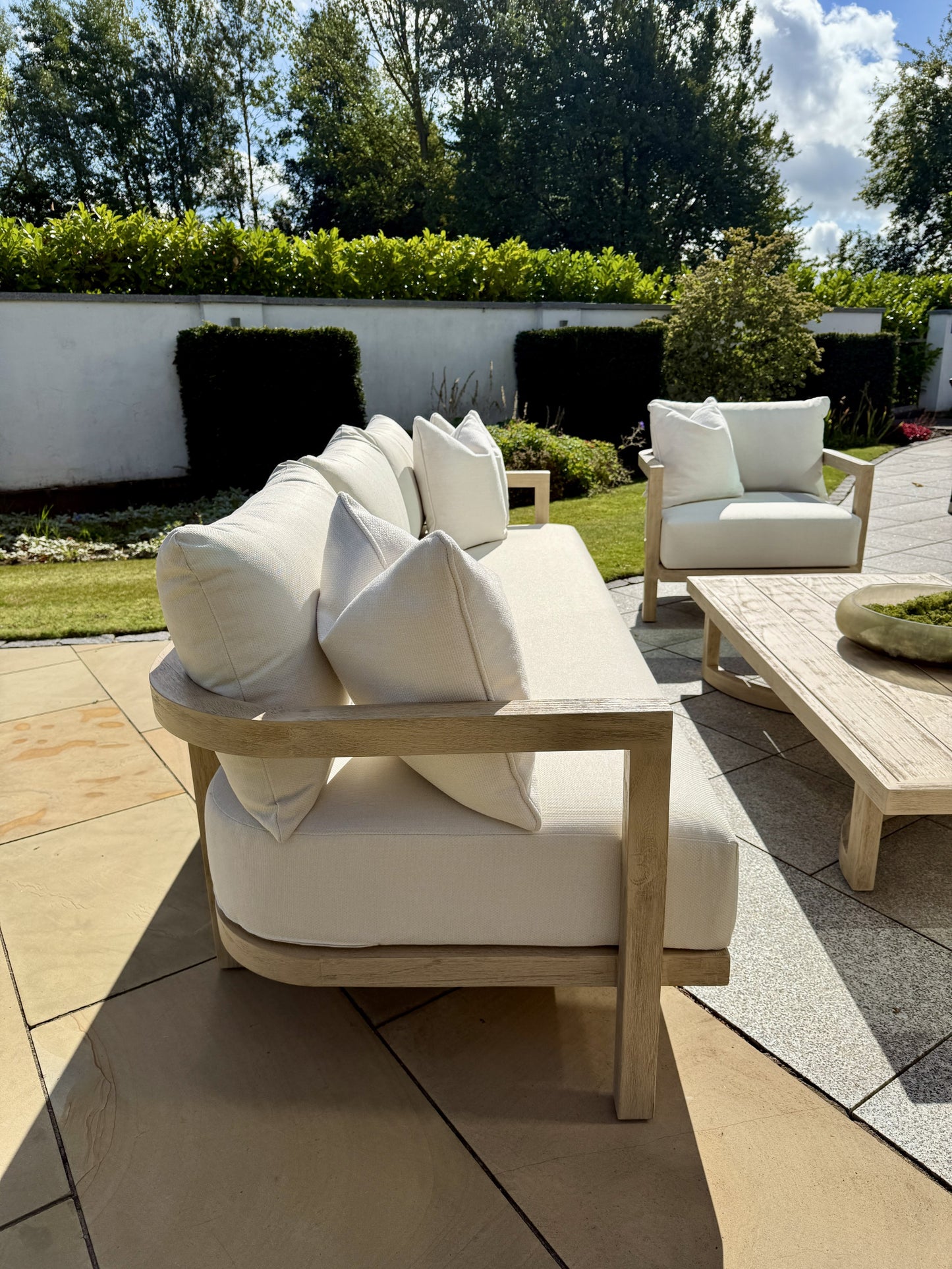 Hamilton Teak Lounge Set lifestyle image with armchairs and coffee table