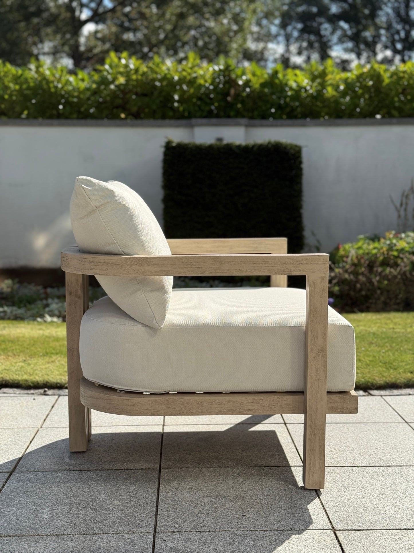Hamilton Teak armchair side view displaying comfortable outdoor seating