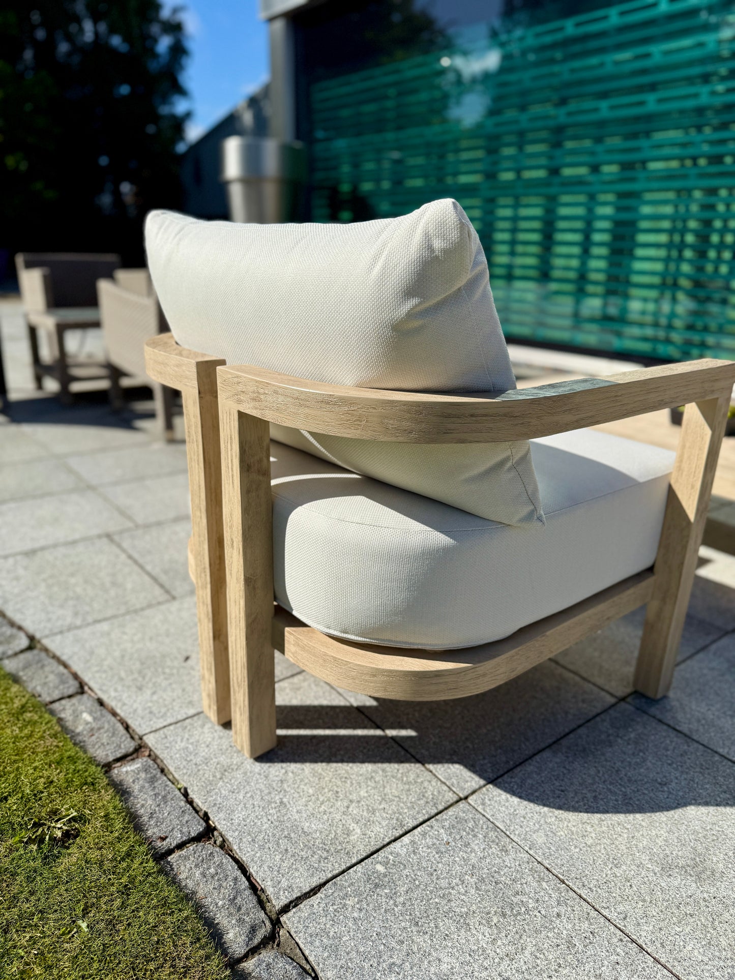 Hamilton Teak Armchair outdoor furniture detail shot highlighting the rear detail leg