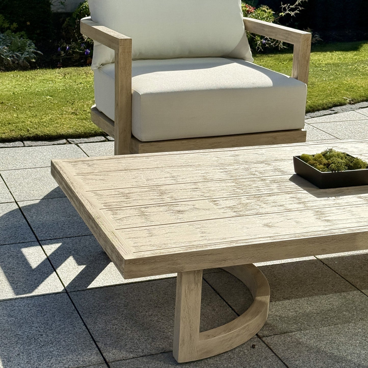 Hamilton Teak coffee table square format highlighting matching outdoor furniture