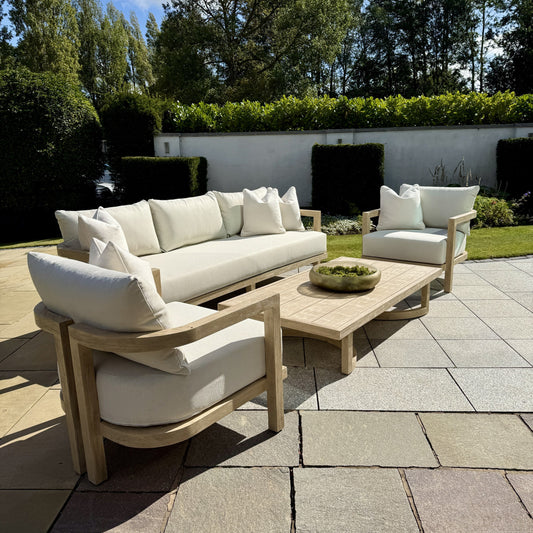 Hamilton Teak outdoor furniture set arranged in elegant patio display